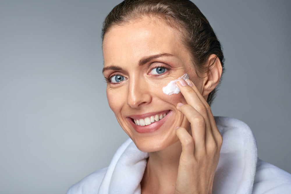 Beautiful middle aged women applying hyaluronic acid to plump the skin